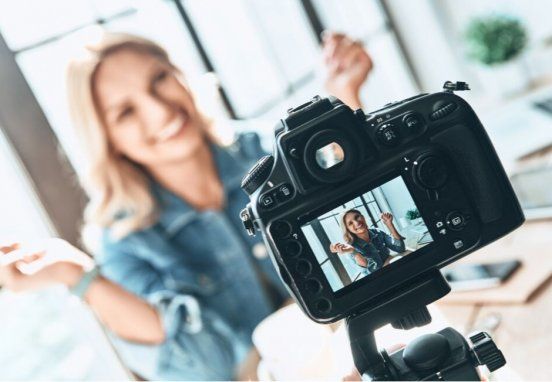 Image of a lady and a cameraa